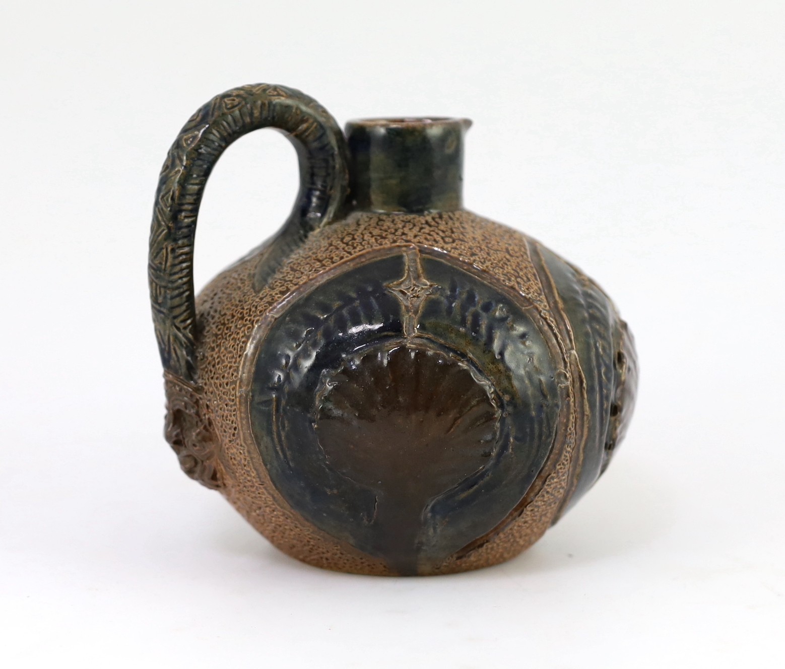 A Martin Brothers stoneware jug, c.1879, 14cm high